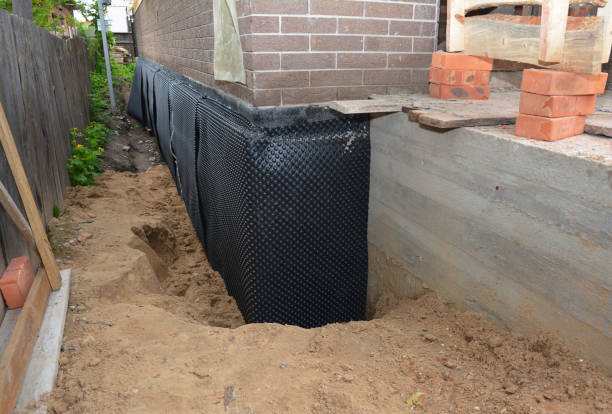 SJ Waterproofing Pros technician performing targeted Exterior Waterproofing assessment in Wheeler, IN